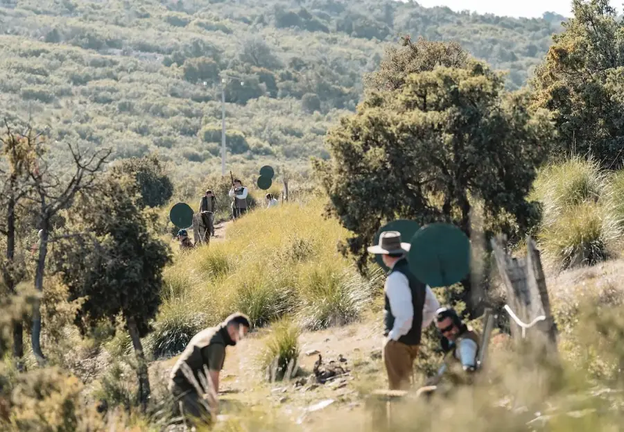Guns and loaders making their way along a scrub hillside at El Despenadero